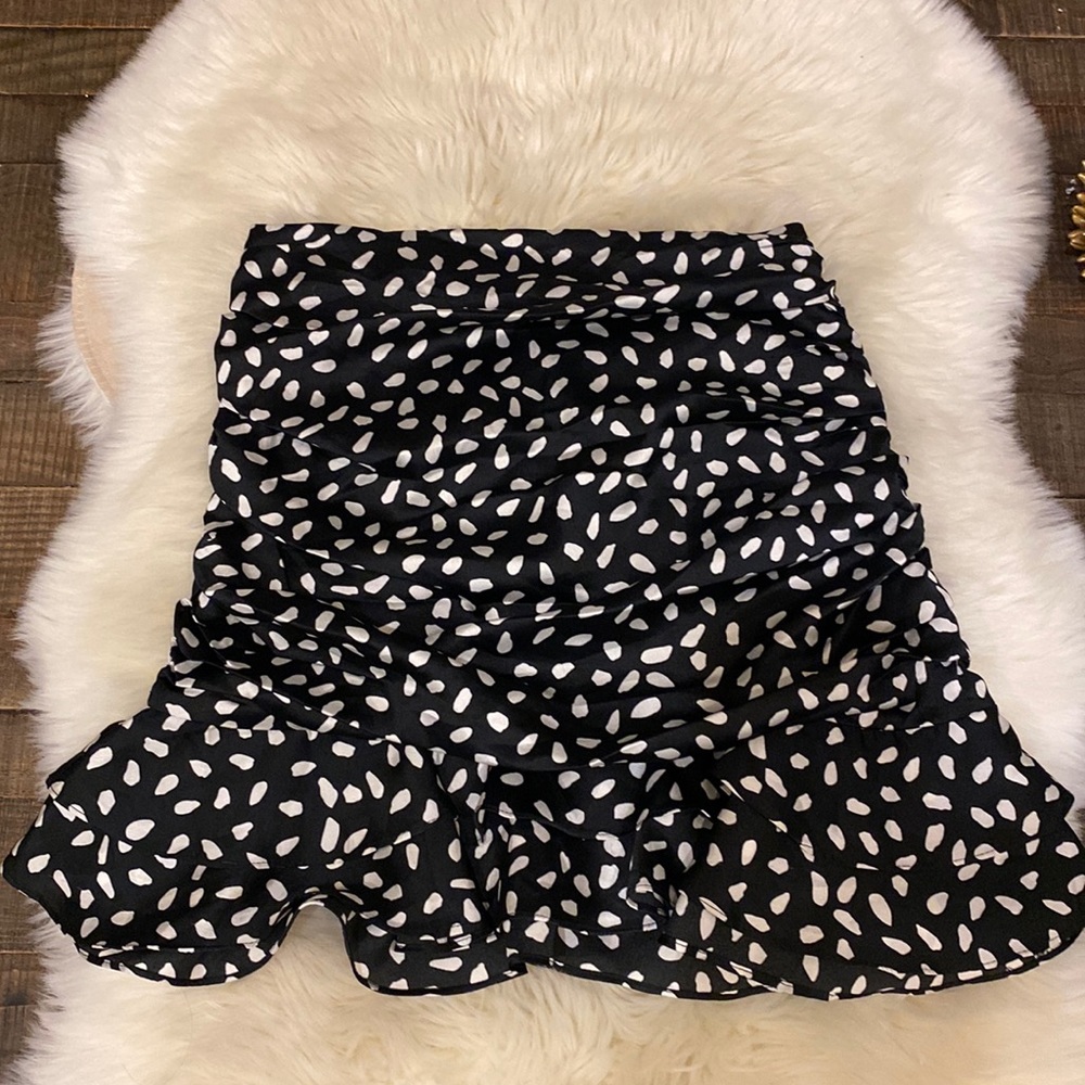 Black skirt with white polka dots